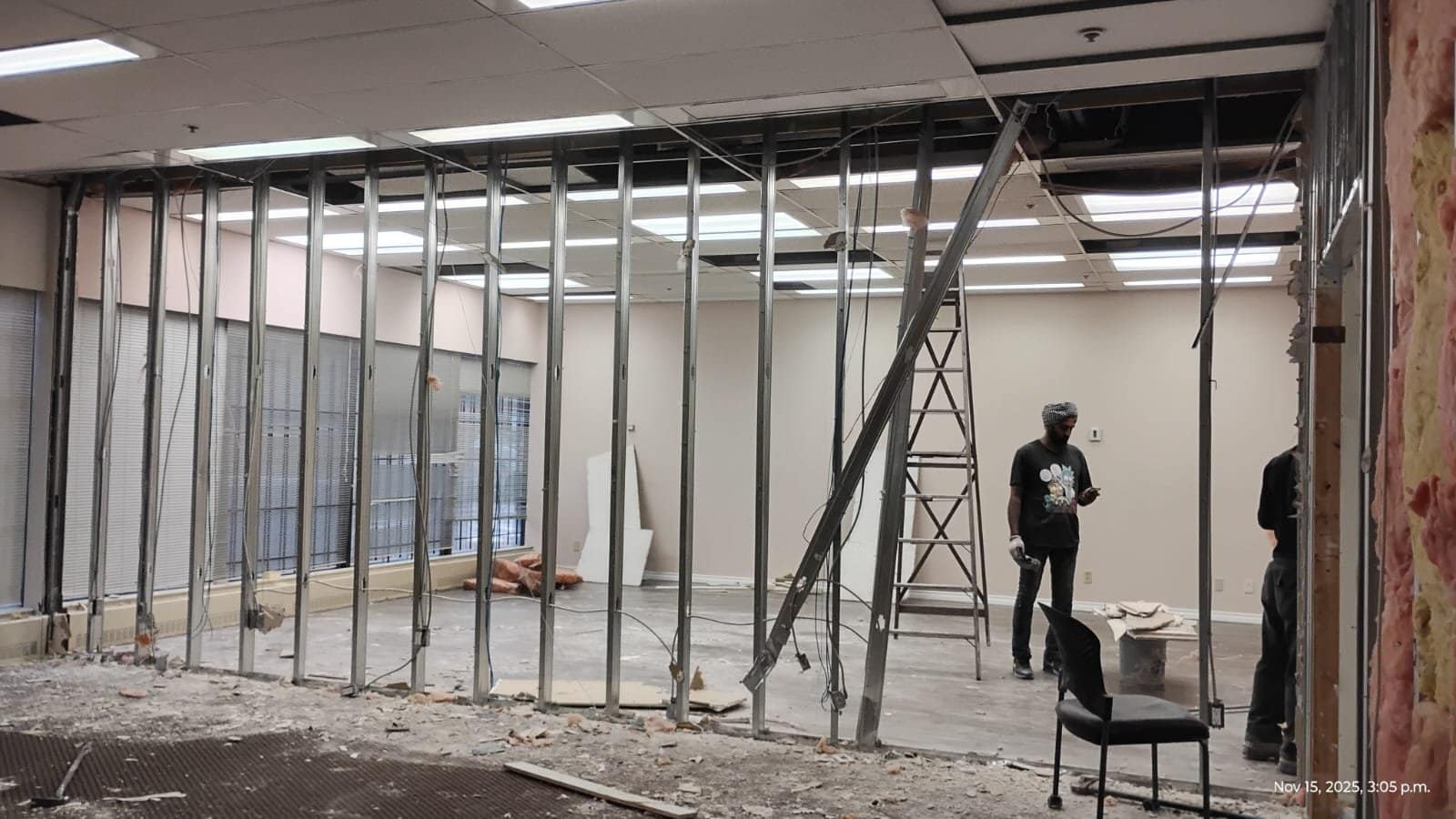 Steel stud wall framing installed with metal tracks and vertical studs